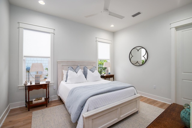 bedroom with recessed lighting, visible vents, light wood-style flooring, and baseboards