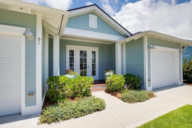 view of front of house with covered porch, driveway, and a garage