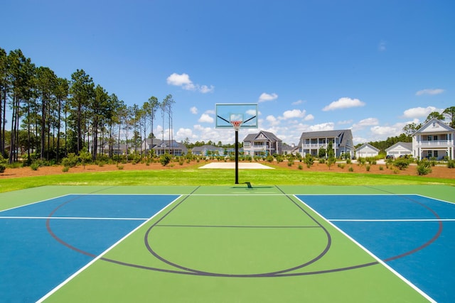 view of basketball court featuring a yard and community basketball court