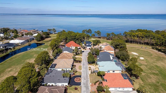 aerial view with a residential view and a water view