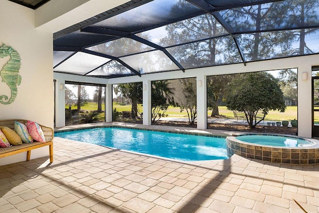 view of pool with glass enclosure, a patio area, and a pool with connected hot tub