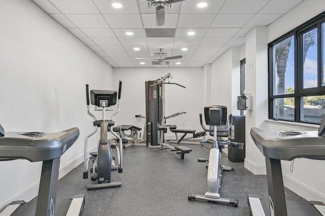 exercise room with a paneled ceiling