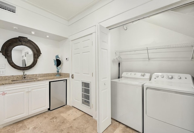 139 Brown St, Santa Rosa Beach, FL 32459 - clothes washing area with sink, crown molding, and washer and clothes dryer