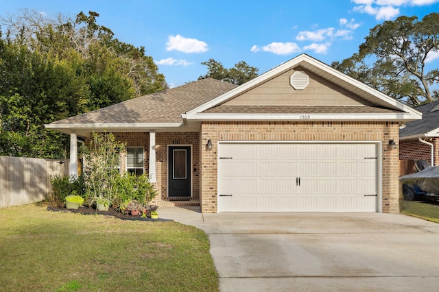 ranch-style home with a garage, brick siding, driveway, roof with shingles, and a front yard