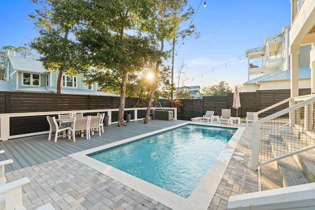 view of pool with a wooden deck