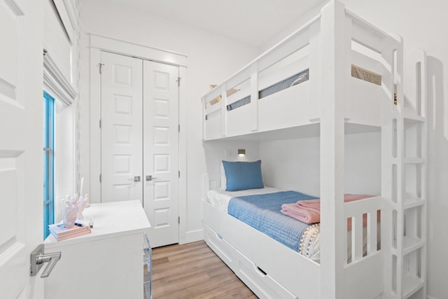 bedroom featuring a closet and light wood-type flooring