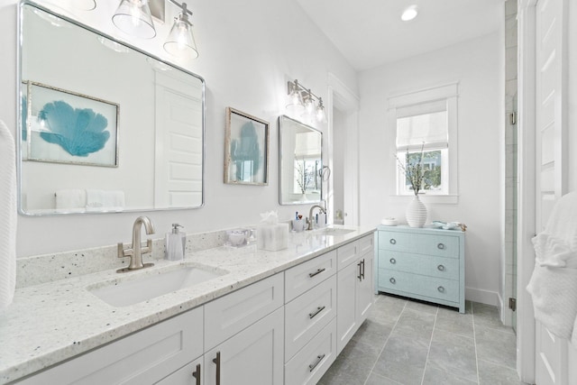 bathroom with vanity and tile patterned floors