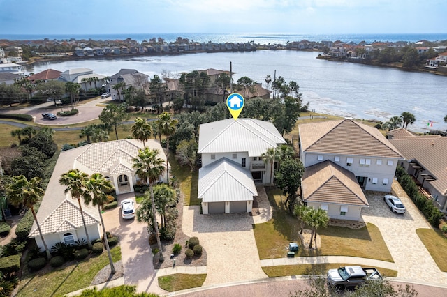 birds eye view of property with a water view