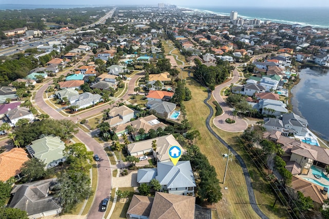 birds eye view of property with a water view