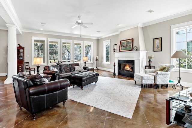 living room featuring decorative columns, ornamental molding, and ceiling fan