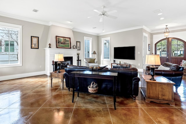 living room featuring crown molding and ceiling fan