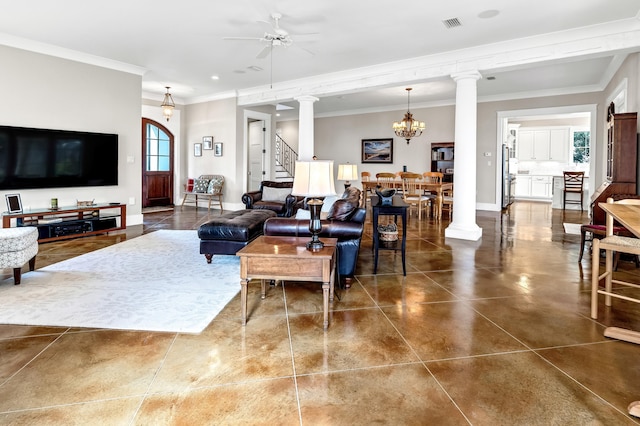 living room featuring ceiling fan with notable chandelier, ornamental molding, and ornate columns