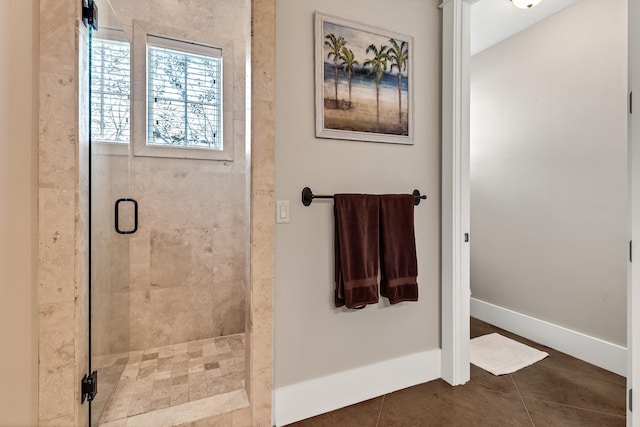 bathroom featuring tile patterned flooring and a shower with shower door