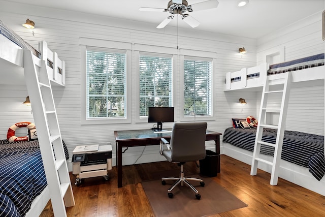 office area with a wealth of natural light, dark hardwood / wood-style floors, and ceiling fan