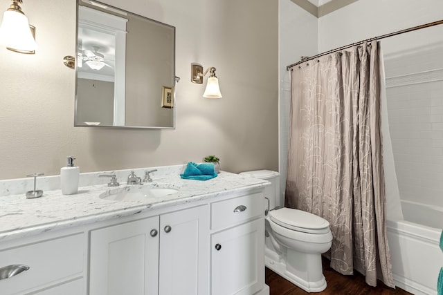 full bathroom featuring vanity, toilet, wood-type flooring, and shower / bath combo