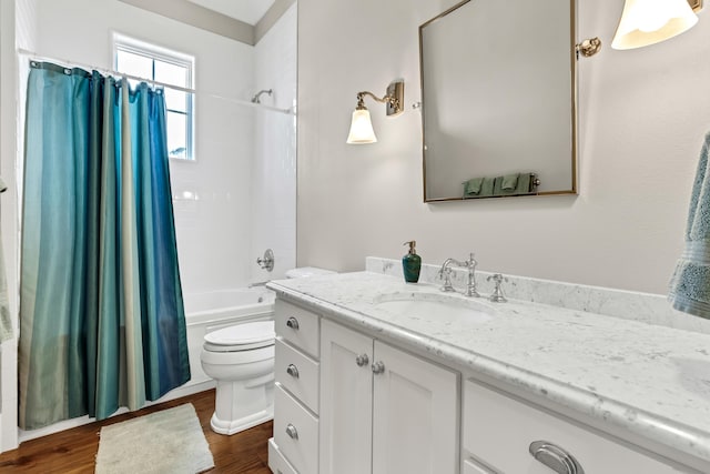 full bathroom featuring vanity, shower / tub combo, hardwood / wood-style flooring, and toilet