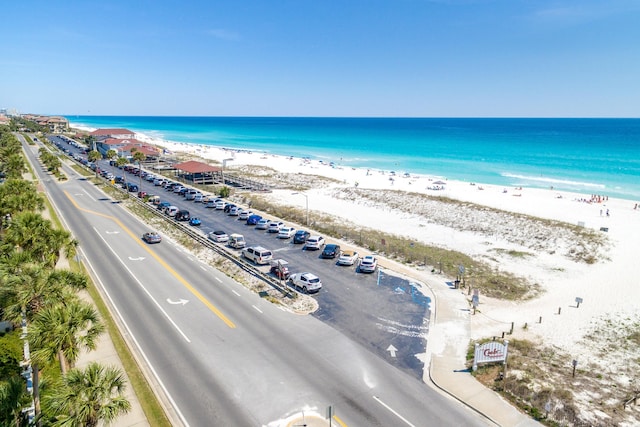 drone / aerial view featuring a view of the beach and a water view