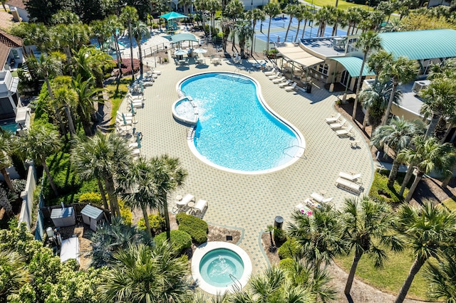 view of pool with a patio and a community hot tub