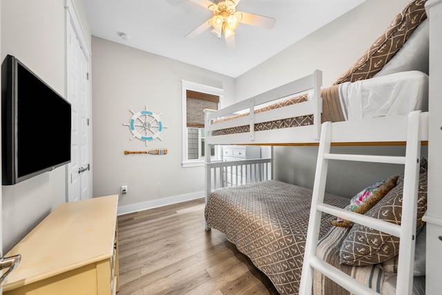 bedroom with ceiling fan and hardwood / wood-style floors