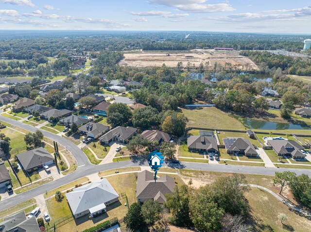 birds eye view of property featuring a residential view and a water view