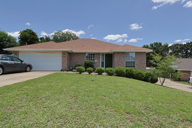 5205 Whitehurst Ln, Crestview, FL 32536 - ranch-style house with a garage, a front lawn, driveway, and brick siding