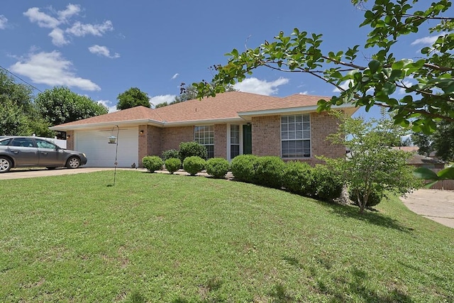 5205 Whitehurst Ln, Crestview, FL 32536 - single story home with an attached garage, a front lawn, brick siding, and driveway