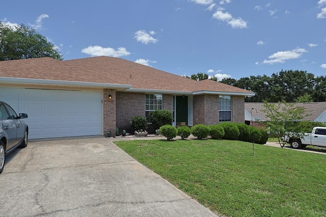 5205 Whitehurst Ln, Crestview, FL 32536 - ranch-style home with brick siding, a front lawn, concrete driveway, and a garage
