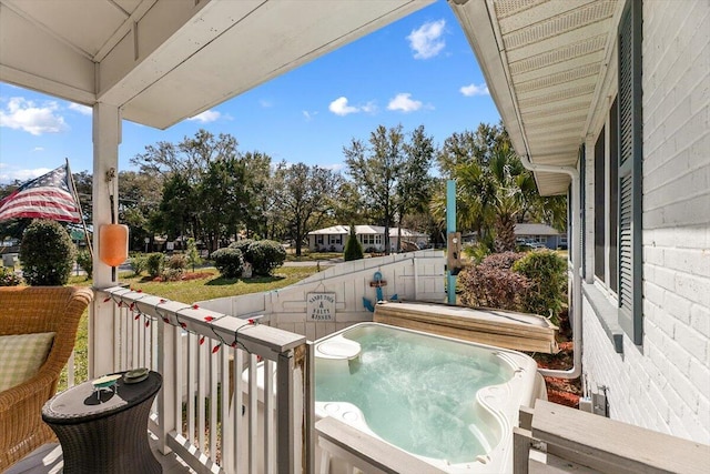 balcony with a hot tub