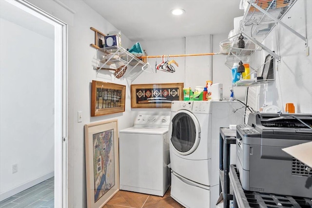 clothes washing area with laundry area, washer and clothes dryer, and recessed lighting