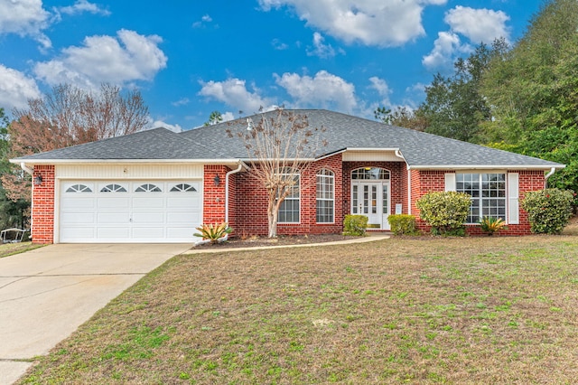 single story home with a garage and a front lawn