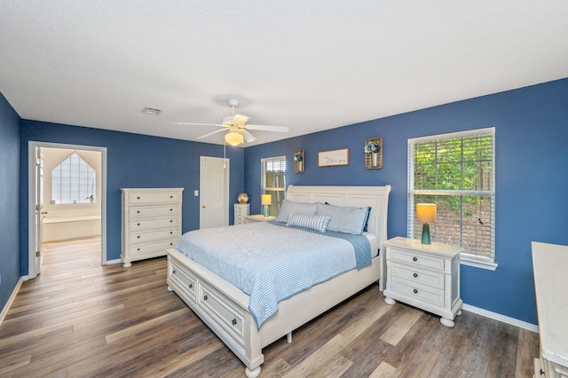 bedroom featuring dark hardwood / wood-style floors and ceiling fan