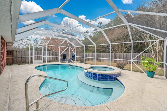 view of swimming pool featuring an in ground hot tub, a lanai, and a patio area