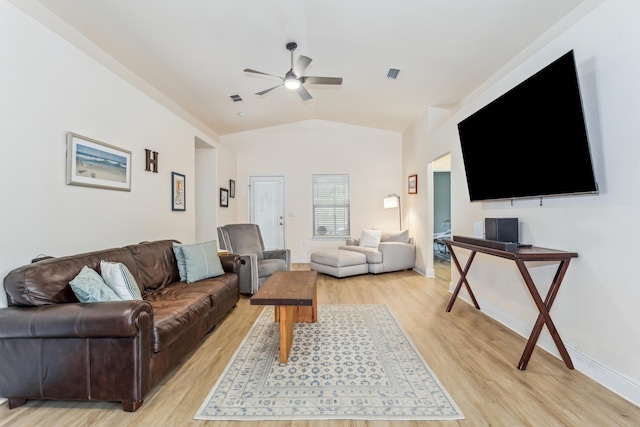 living room with baseboards, visible vents, a ceiling fan, vaulted ceiling, and light wood-type flooring