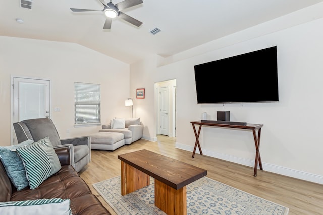 living area with visible vents, light wood-style floors, vaulted ceiling, ceiling fan, and baseboards