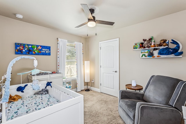 bedroom with carpet, a ceiling fan, and baseboards