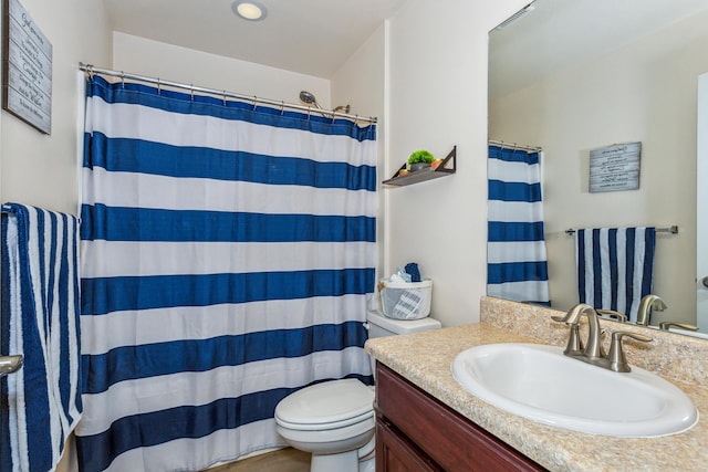 bathroom with a shower with curtain, visible vents, vanity, and toilet