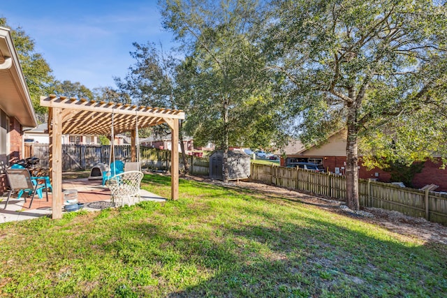 view of yard with a patio, a fenced backyard, a storage shed, an outdoor structure, and a pergola