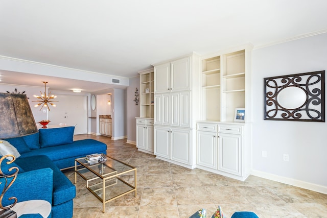 living room featuring a notable chandelier and crown molding