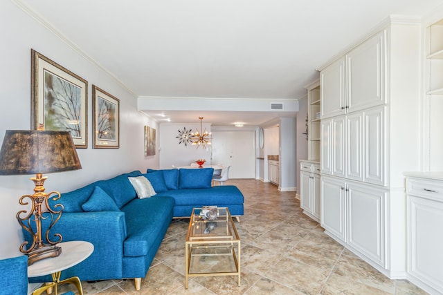 living room featuring a chandelier and ornamental molding