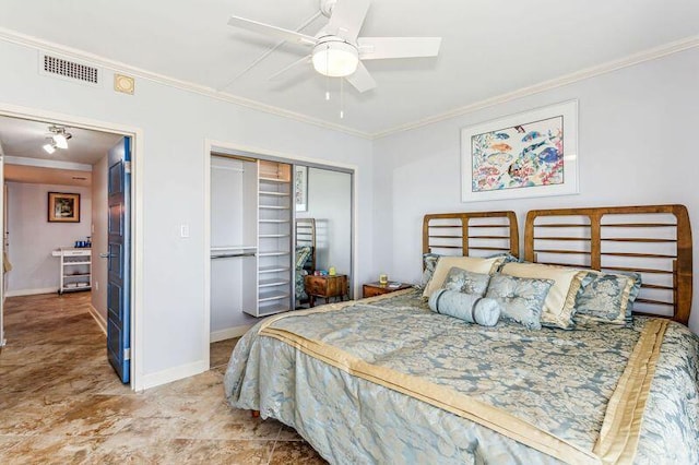 bedroom with ceiling fan, crown molding, and a closet