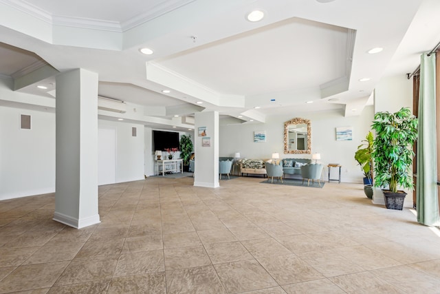 unfurnished living room featuring a tray ceiling, ornamental molding, light tile patterned flooring, and ornate columns