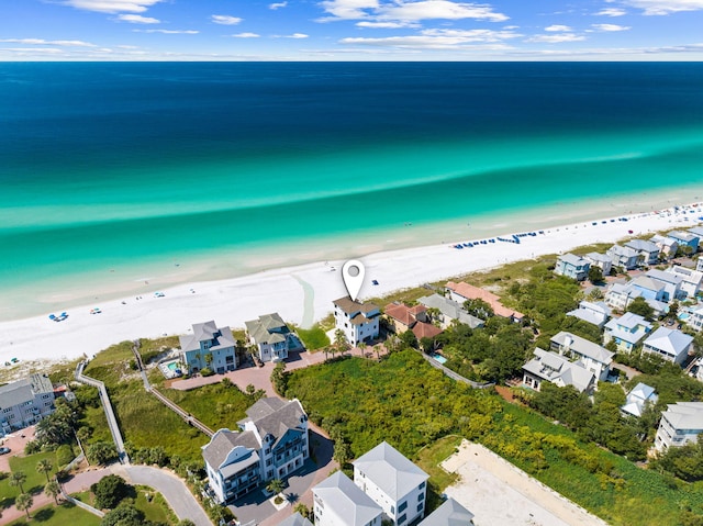 bird's eye view with a view of the beach and a water view