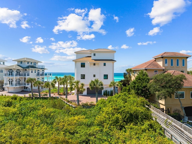 back of property with a water view