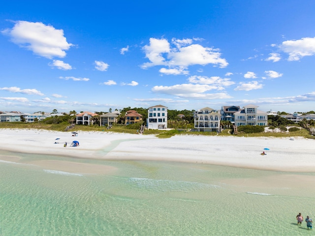 bird's eye view with a water view and a view of the beach