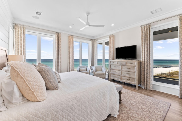 bedroom with crown molding, ceiling fan, access to outside, and light wood-type flooring