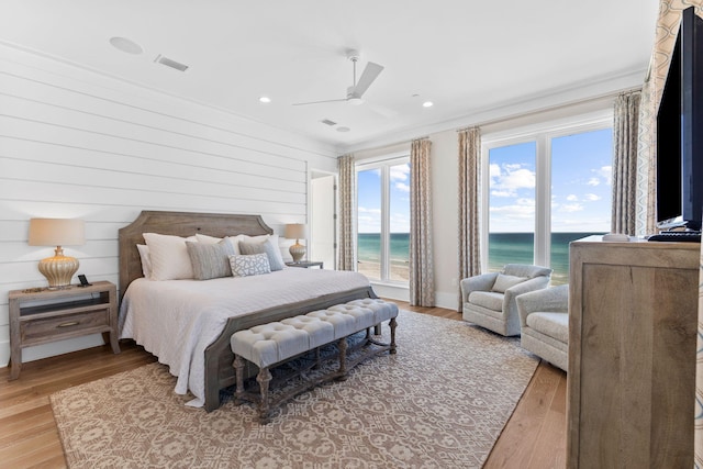 bedroom featuring ceiling fan, access to exterior, and light wood-type flooring