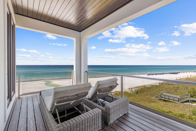 exterior space with a water view and a beach view