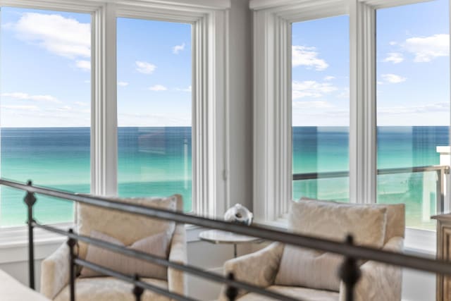 unfurnished bedroom featuring a water view and multiple windows