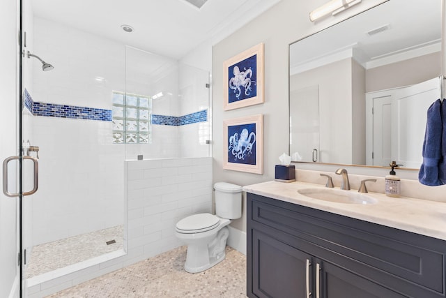 bathroom with a shower with door, crown molding, vanity, and toilet