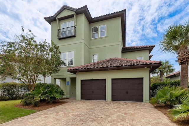 mediterranean / spanish house featuring a garage